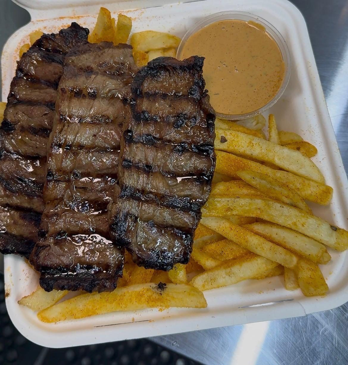 Grilled wagyu steak strips with seasoned chips and special sauce